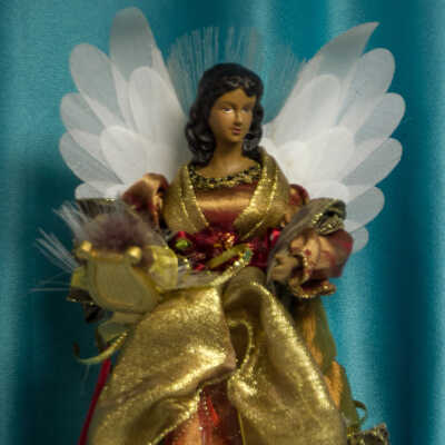 Red and gold angel with white wings