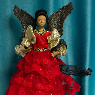 Red gowned black winged angel