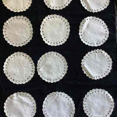 12 small cotton doilies