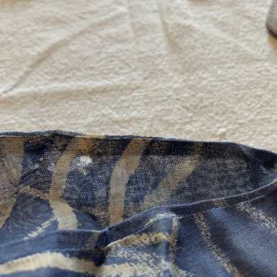 Small hole: Bottom left sleeve jacket