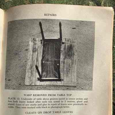 Representative page: Wood table laying on piece of plywood, instructions for repairing warped boards