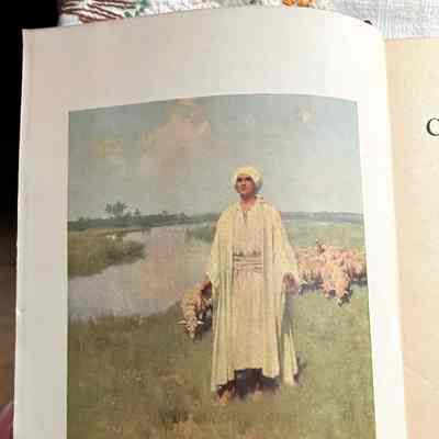 "The Lord is My Shepherd": Man in white robes and headwrap (Jesus?) in front of flock of sheep on riverbank. Captioned "The Lord is My Sheperd." C. Curtis Publishing Co.
