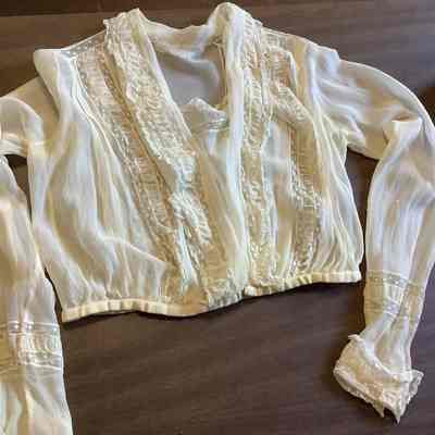 Blouse with lace cuffs and gathered waistline