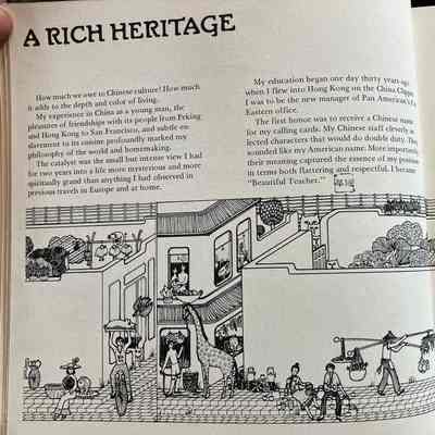 Page 1 of book: A rich heritage: Line drawing of neighborhood with people going about daily lives, including "typical" Chinese street happenings such as person riding unicycle carrying roasted pig overhead, tea kettles on open stoves, people with bowls