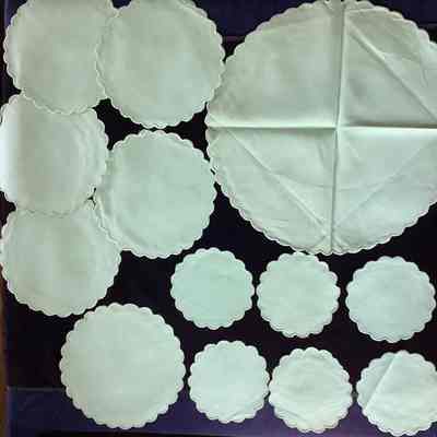 13 green cotton doilies