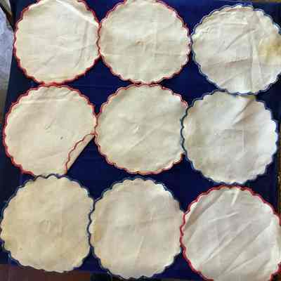 Nine scalloped edge rounds