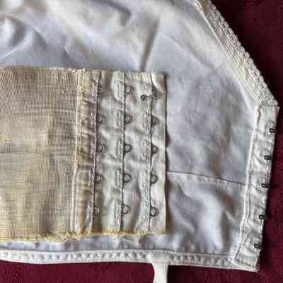 Shows elastic and 5 rows of hook and eye fasteners.