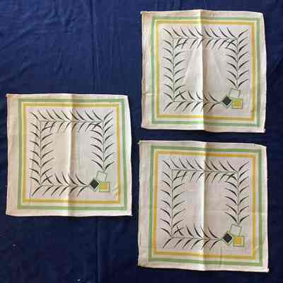 Four decorative linen squares