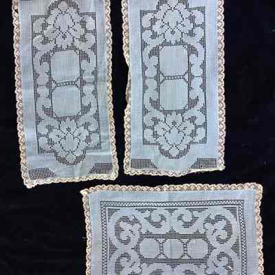 Three blue rectangle lace pieces