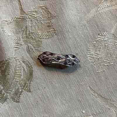 Silver toned brooch with clear gems