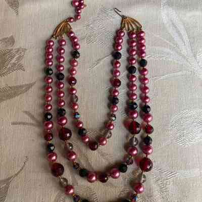 Three strand, pink and red beaded necklace