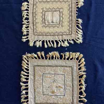 Two intricate linen textiles