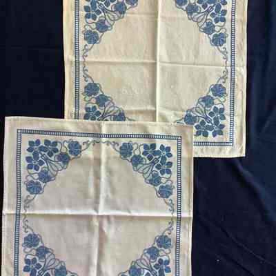 Two blue and white napkins