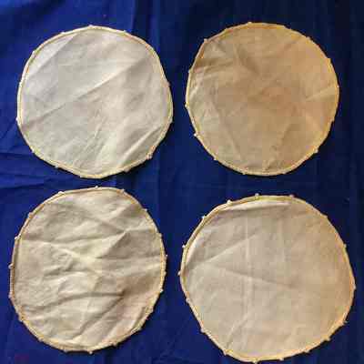 Four orange cotton circles