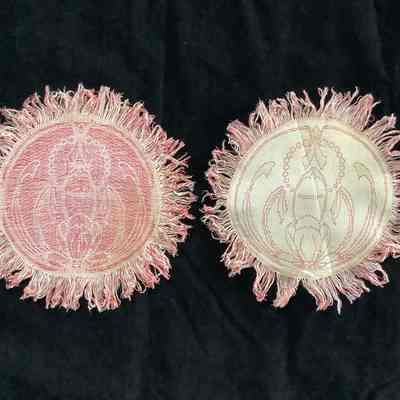 Three Embroidered doilies