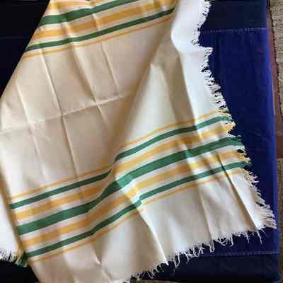 Green and yellow stripped table cloth
