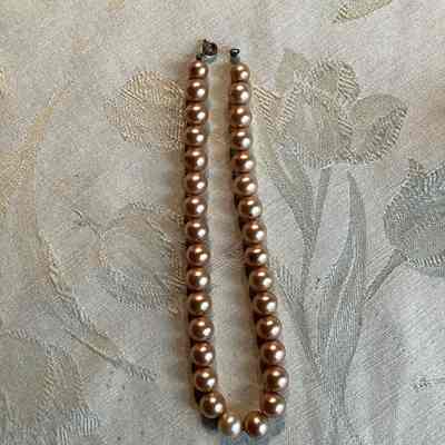 Gold toned, plastic beaded necklace