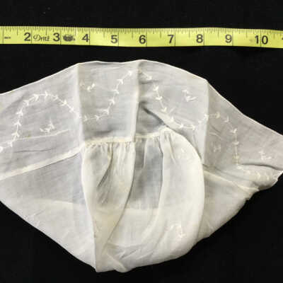White cotton W.A.Bray baby bonnet with embroidered trim