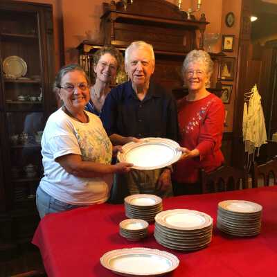 Patrician Reidenbach, Patricia Donald, Richard Lyman III, Nancy Donald accept Richards donation of dishes from Fernside Estate. August 19, 2019