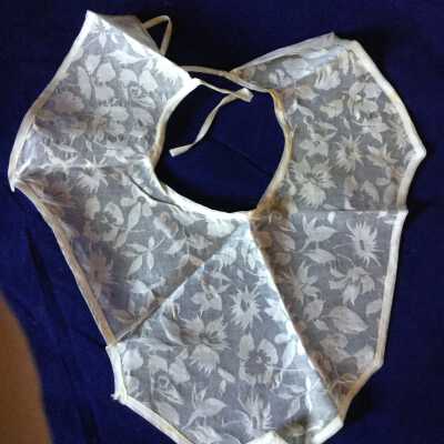 yoke with tie back, off white cotton with floral burnout (?) design