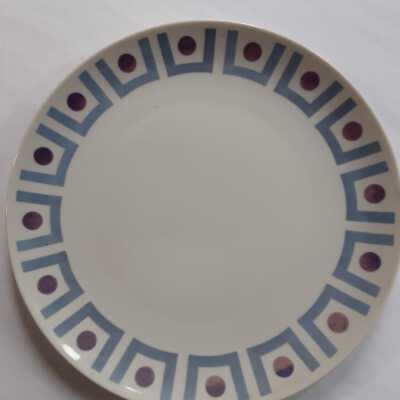 Plate with purple circles and blue boxy pattern