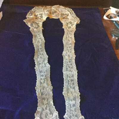 Lace cutwork collar with long lace tie ends in front