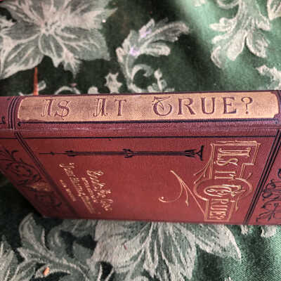 Spine: Red book stood on end, "Is it true?" fills whole spine