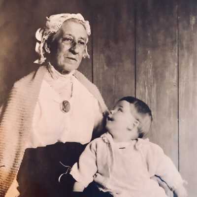 "Grandmother Cohen in 1918 + ?: Emilie Cohen seated with Child on her lap