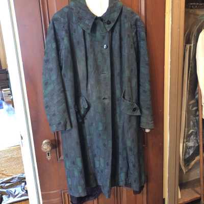 Raincoat. Green abstract pattern