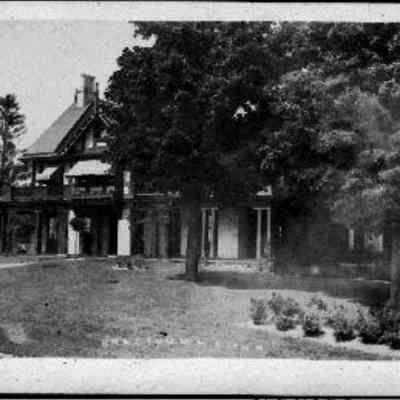 Bradford Manor: This photo postcard showcases a large, elegant house with a porch, surrounded by lush trees.
