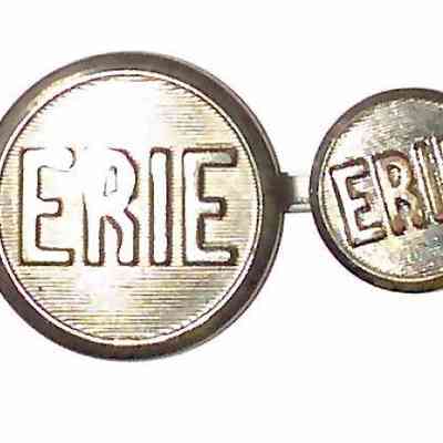 Erie R.R. Uniform Buttons - face.: The image shows a series of metal buttons, each inscribed with the word "ERIE," on
