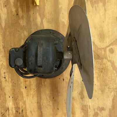 General Electric oscillating electric fan - top view.: The image shows the top of the three-blade metal fan that was used in the 1915 Erie Station.