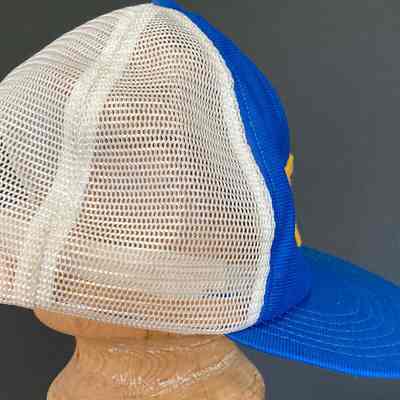Stephen Schlinger's Troy Little League Team cap - right side: A blue and white mesh trucker cap is displayed on a wooden mannequin head.