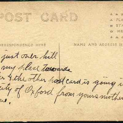 Address side of the "Claudius Smith’s Cave, Goosepond Mts, Chester, NY" postcard.: The image shows the back of an old postcard featuring handwritten text on the left side, which is designated for correspondence, and reads, "This just one hill from my place towards Chester & the other postcard is going into the city of Oxford from yours mother old home." On the right, the space is marked for writing the recipient's name and address, while the top right section is reserved for placing a stamp. The paper appears to be aged, with a yellowed tone indicating its vintage nature,