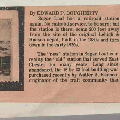 A depot for Sugar Loaf: The image displays a newspaper clipping discussing the history and renovation of the old East Chester L&HRR depot becoming the new Sugar Loaf railroad station, which is depicted on a simulated postage stamp to the left. The article highlights that the original station, replicated on the stamp, representing the old East Chester L&HRR depot and provides details about the relocation and preservation efforts by new owners who plan to rejuvenate and repurpose the building, preserving its historical value while adapting it to contemporary uses. Additionally, the photograph featured in the simulated stamp shows two individuals standing in front of the depot.