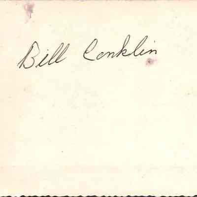 Bill Conklin written on the back of the picture.: The image displays the name "Bill Conklin" handwritten in black ink on the back of the picture.