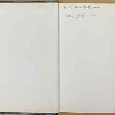 1st Page: The image depicts an open book with the left page completely blank, while the right page contains a handwritten inscription. The inscription is neatly written in cursive in the top right corner, indicating the number 90, followed by the name Helen R. Predmore. Below this, another line features the name Harry Yock, accompanied by the date 1975. The pages appear slightly aged, with subtle discoloration along the edges, suggesting an old book that has been well-preserved. The book's spine and cover are partially visible, revealing a dark green color, possibly made of a textured material. The overall appearance conveys a sense of personal significance, perhaps marking ownership, a gift, or a special dedication related to the individuals mentioned. The simplicity of the scene is enhanced by the absence of additional text or imagery, allowing the focus to remain on the penned words and the historical context they may represent. It evokes curiosity about the names' significance and the book's potential content or memorable value to its recipients