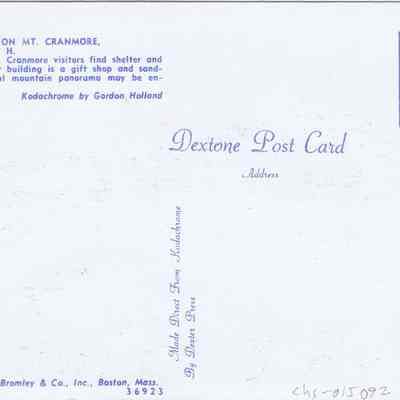 Address side of the "Summit Building on Mt. Cranmore" postcard.: The image shows the back of a vintage postcard labeled as "Dextone Post Card," detailing the Summit Building on Mt. Cranmore in North Conway, N.H. The description on the card highlights that visitors can find shelter and relaxation at the summit, which houses a gift shop and sandwich bar, and enjoy beautiful mountain views. It also mentions the postcard was made by Dexter Press and includes the publication information exclusive to Bromley & Co., Inc., Boston, Mass.