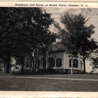 20830 Residence & Scene at Brook farm.: The image shows a large, brick residence surrounded by lush trees at Brook Farm in Chester, New York