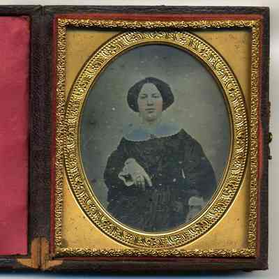 Seated lady with tinted cheeks and collar