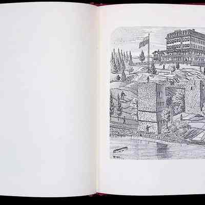 The image shows an open book displaying a page with a detailed illustration and text. On the right side, the illustration depicts a large multistory building with numerous windows situated atop a hill, and surrounded by landscape consisting of trees, pathways, and elements of a small community. There are stone ruins in the foreground with a small satellite structure nearby. This scene is set along a body of water, where a sailboat can be seen cruising near the shore. To the left, the text portion discusses historic details about the "Parry House, Highland Falls," a resort hotel previously built beside the Hudson River, which took advantage of the easy transportation provided by the river. The text narrates the history related to this location involving transportation and hotel business that once thrived there, mentioning names and specific historical events connected to the property.