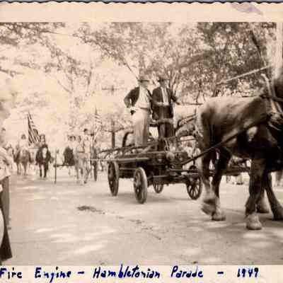 Fire Engine - Hambletonian Parade - 1949: The image shows a horse-drawn fire engine.