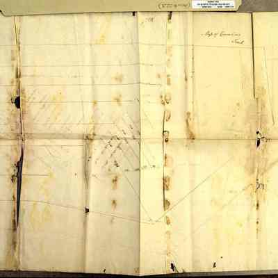 Map of Cromline Tract reverse.: The image shows the back of an old, stained map displaying various land plots with handwritten labels and boundary lines.