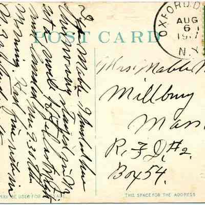 Address side of postcard.: The image displays the reverse side of a vintage postcard, featuring handwritten cursive text on the left and an address on the right. The postcard is addressed to "Miss Mable Malhort, Millbury, Mass., R.F.D. #2, Box 54." The postmark is dated August 6, 1917, from Oxford, N.Y., and there is a green one-cent U.S. postage stamp featuring an image of Benjamin Franklin. The card likely conveys a personal message that the writer stayed in NY at a swell Hotel…