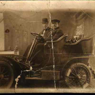 Gentlemen in horseless carriage