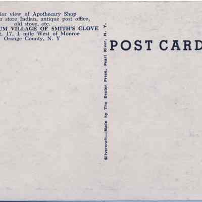 Address side of the "Interior of Apothecary Shop at Old Museum Village Of Smith's Clove" postcard.: The image depicts a vintage postcard, mainly text-based, promoting the Old Museum Village of Smith's Clove, featuring an interior view of an apothecary shop, a cigar store Indian, an antique post office, and an old stove, located on Route 17, one mile west of Monroe in Orange County, New York; published by Dexter Press with a Silvercraft design.