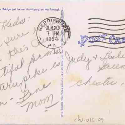 Address side of the "Susquehanna River Bridge, Pennsylvania Turnpike" postcard.: The image displays the back of an old postcard, featuring handwritten correspondence, a postal cancellation from Harrisburg, PA dated June 20, 1954, and a red 2-cent U.S. postage stamp. The message mentions the Susquehanna River Bridge and is signed off affectionately by "Mom.” The postcard is addressed to individuals named Judy and Leslie Greenwald in Chester, N.Y.