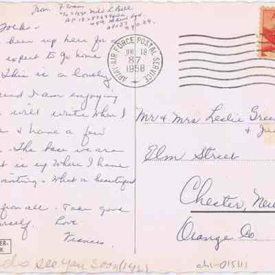 Address side of the "Wiesbaden, Germany" postcard.: The image displays a vintage airmail postcard dated July 18, 1958, with a 6-cent U.S. postage stamp featuring a red airplane. The postcard, addressed to Mr. and Mrs. Leslie Greenwood Sr. in Chester, New York, includes a handwritten message expressing the sender’s enjoyment of a lovely place and beautiful views. The postcard also shows a cancellation mark from "AIR FORCE POSTAL SERVICE," indicating it was sent through military mail.