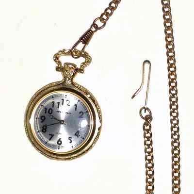 Milan Pocket Watch - face: A vintage pocket watch with a long metal chain and ruler underneath, showcasing classic design elements.