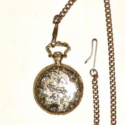 Milan Pocket Watch - back: The image shows an ornate pocket watch with a decorative chain and intricate engravings.